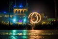 Night performance fire show in front of a crowd of people