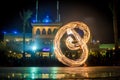 Night performance fire show in front of a crowd of people Royalty Free Stock Photo