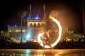 Night performance fire show in front of a crowd of people