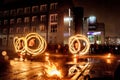 Night performance fire show in front of a crowd of people