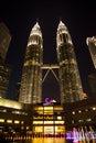 Night Petronas towers and Suria shopping mall, Kuala Lumpur