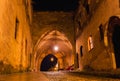 Night photo of ancient street of the Knights in Rhodes city on Rhodes island, Dodecanese, Greece. Stone walls and bright night