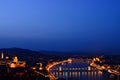night photo at blue hour of Budapest with the Chain bridge, the Danube and the Parliament Royalty Free Stock Photo