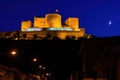 Night photo of the castle of Consuegra. Night landscape with the moon. Royalty Free Stock Photo