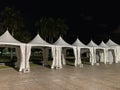 Night photo of event tents in the park