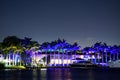 NIght photo Miami Beach mansions and yachts neon blue lights