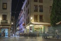 Night photo of streets of Granada with shops, cafes and Cathedral of Granada 30.Sept.2020 Albacin, Spain. Blurred people motions