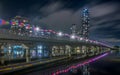 a night photo of the Sundale Bridge with lights, reflections and high rises Royalty Free Stock Photo