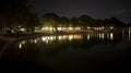 Night photography of a lake with trees on its shore