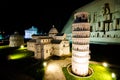 Night photography of the Torre pendente di Pisa at miniature park is an open space that displays miniature buildings and models.