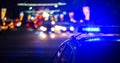 Night police car lights in city - close-up with selective focus and bokeh Royalty Free Stock Photo