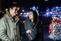 Night portrait of a happy couple smiling enjoying winter and snow aoutdoors.Winter joy.Positive emotions.Happiness Royalty Free Stock Photo