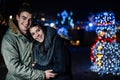 Night portrait of a happy couple smiling enjoying winter and snow aoutdoors.Winter joy.Positive emotions.Happiness Royalty Free Stock Photo