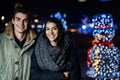 Night portrait of a happy couple smiling enjoying winter and snow aoutdoors.Winter joy.Positive emotions.Happiness Royalty Free Stock Photo