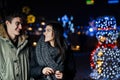 Night portrait of a happy couple smiling enjoying winter and snow aoutdoors.Winter joy.Positive emotions.Happiness Royalty Free Stock Photo