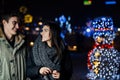 Night portrait of a happy couple smiling enjoying winter and snow aoutdoors.Winter joy.Positive emotions.Happiness Royalty Free Stock Photo