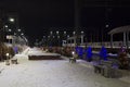 The night railway station is decorated with festoons for the new year