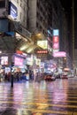 Night rain at Tsim Sha Tsui crossing in Kowloon, Hong Kong Royalty Free Stock Photo