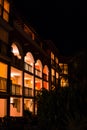 Night resort environment with silhouetted area and white columns and pillars at door entrance