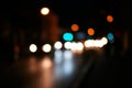 Night road city blur bokeh shot. Blurred street with carlights in night time. Defocused urban scene. Toned shot Royalty Free Stock Photo