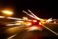 Night road. Motion blurred image