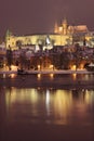 Night romantic colorful snowy Prague gothic Castle with Charles Bridge Royalty Free Stock Photo