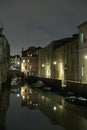 Night row of houses water reflection