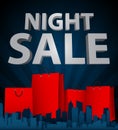 Night sale with shopping bag in city