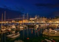 Night scape of harbour of Piran, Slovenia. Historic old buildings and church with italian campanile on the hill Royalty Free Stock Photo