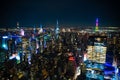 Night scene across the city of Manhattan, New York City with many illuminated buildings