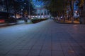 Night scene of city road in Kutaisi. City night park in autumn with paths strewn Royalty Free Stock Photo