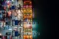 Container ship loading and unloading in deep sea port, Aerial view at night Royalty Free Stock Photo