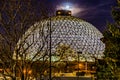 Night scene of the Desert Dome with the moon riding on top at Henry Doorly Zoo Omaha Nebraska. Royalty Free Stock Photo