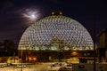 Night scene of the Desert Dome, with the moon riding on the side, at Henry Doorly Zoo Omaha Nebraska. Royalty Free Stock Photo