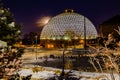 Night scene of the Desert Dome, with the moon barely visible on the side, at Henry Doorly Zoo Omaha Nebraska. Royalty Free Stock Photo