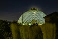 Night scene of the Desert Dome, with the moon barely visible through the top, at Henry Doorly Zoo Omaha Nebraska. Royalty Free Stock Photo