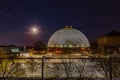 Night scene of the Desert Dome, with the moon riding on the side, at Henry Doorly Zoo Omaha Nebraska. Royalty Free Stock Photo