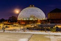 Night scene of the Desert Dome, with the moon riding on the side, at Henry Doorly Zoo Omaha Nebraska. Royalty Free Stock Photo