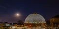 Night scene of the Desert Dome, with the moon riding on the side, at Henry Doorly Zoo Omaha Nebraska. Royalty Free Stock Photo