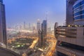 Night scene of Dubai city skyline view of Burj Khalifa from Emirates Grand Hotel top