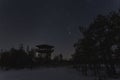 Night scene, Estonian nature in winter time, observation tower on the Viru swamp and starry sky