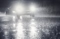 Night scene of hard rain fall in the city. Royalty Free Stock Photo