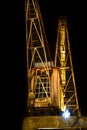 Night scene at a historic harbor in Berlin with old cargo cranes Royalty Free Stock Photo