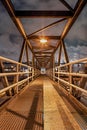 Night scene with Illuminated metal pedestrian bridge