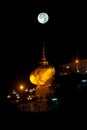 Night scene Kyaikhtiyo Pagoda in full Moon night.