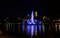 Night scene of the lake and fountain with light reflections in the water at the Heartland of America Park Omaha Nebraska USA.