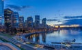 Night scene of modern buildings in Vancouver downtown. Long exposure of waterfront. Colorful city night with skyscrapers Royalty Free Stock Photo