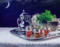 Night scene with Moroccan mint tea service