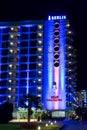 Night scene - neon lights and logo of Berlin Golden Beach hotel