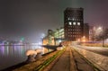 Night scene with old factory shrouded in fog